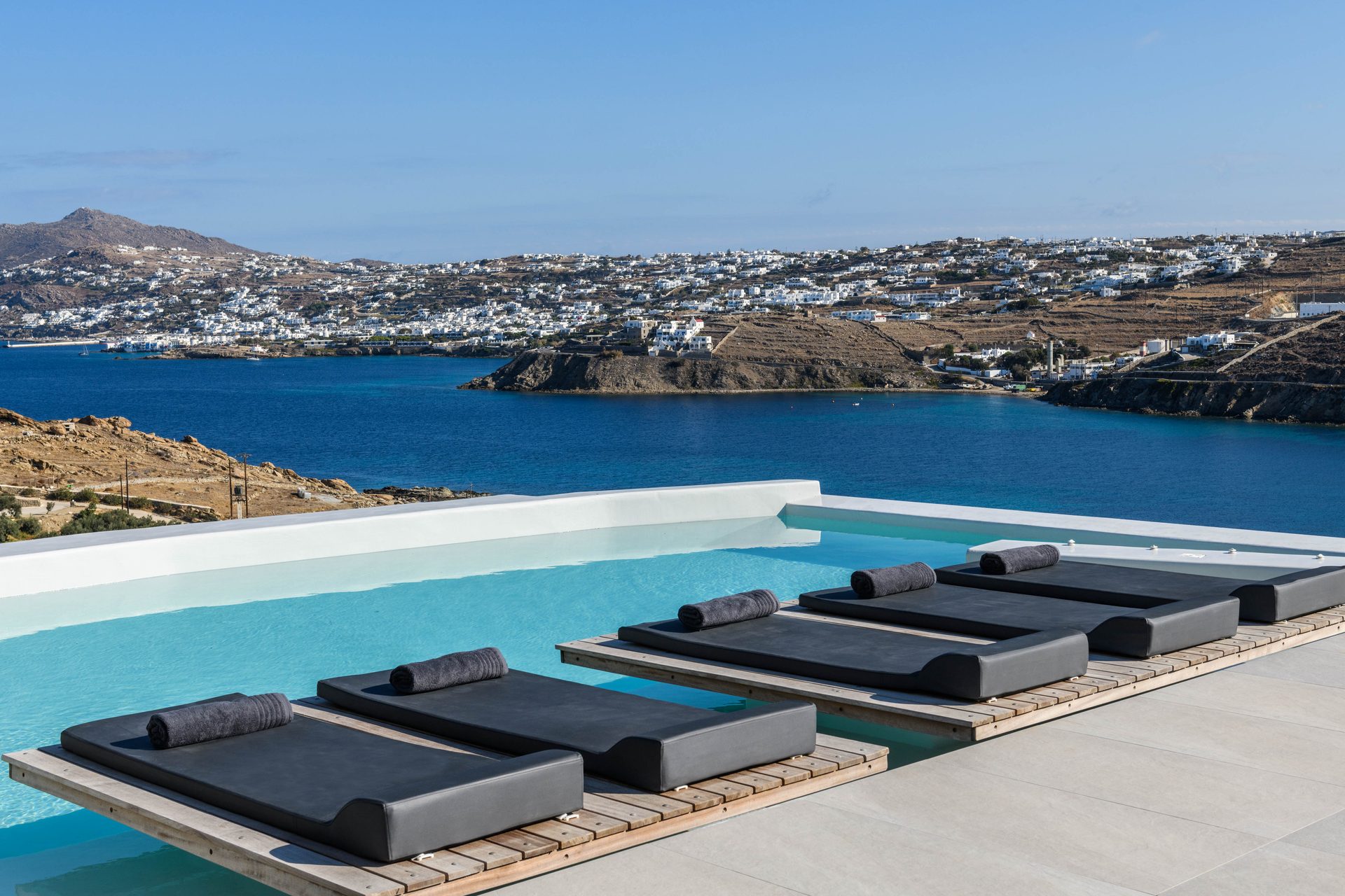 Pool terrace with sea view at Villa Nerovino in Kanalia, Mykonos