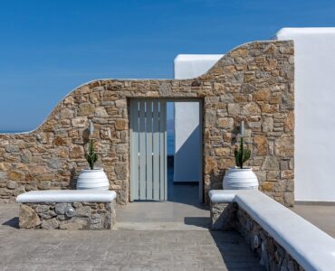 Stone wall and terrace with sea view at Villa Pergisos in Kanalia, Mykonos