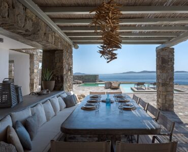 Outdoor dining under the pergola at Villa Pergisos in Kanalia, Mykonos