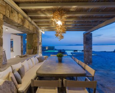 Covered dining terrace with sea view at Villa Pergisos in Kanalia, Mykonos