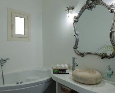 Bathroom with bathtub at Villa Pergisos in Kanalia, Mykonos