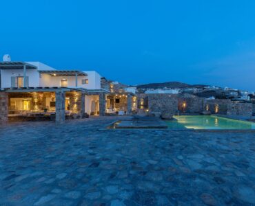Villa lit at dusk at Villa Pergisos in Kanalia, Mykonos