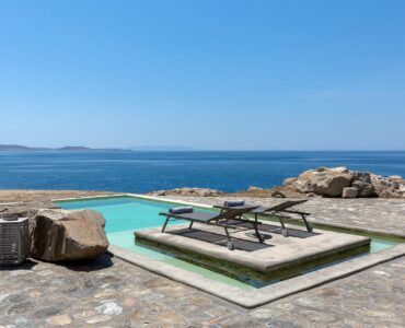 Pool with sun loungers and sea view at Villa Pergisos in Kanalia, Mykonos
