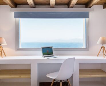 Desk with sea-view window at Villa Phaedra in Pouli, Mykonos