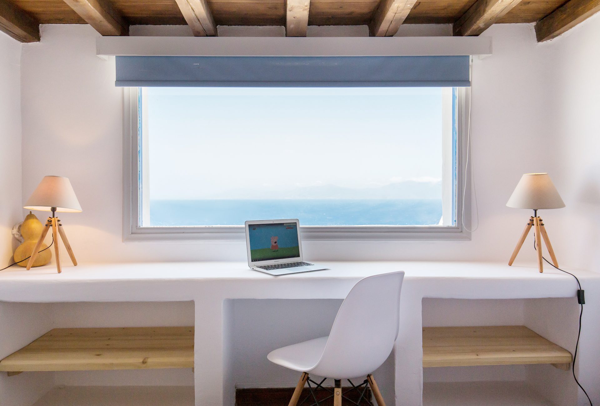 Desk with sea-view window at Villa Phaedra in Pouli, Mykonos