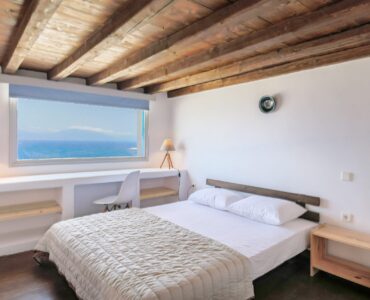 Double bedroom with sea view at Villa Phaedra in Pouli, Mykonos