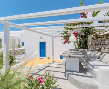 Shaded terrace with built-in seating at Villa Phaedra in Pouli, Mykonos