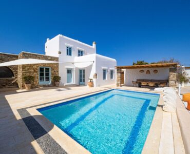 Pool and whitewashed villa at Villa Uranos in Psarou, Mykonos