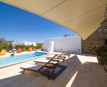 Pool from the shaded terrace at Villa Uranos in Psarou, Mykonos