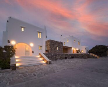 Villa exterior at sunset at Villa Uranos in Psarou, Mykonos