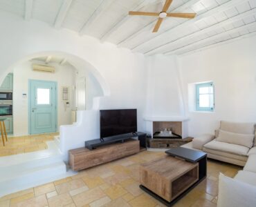 Living room with TV at Villa Uranos in Psarou, Mykonos
