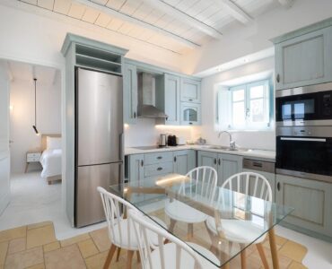 Kitchen and dining area at Villa Uranos in Psarou, Mykonos