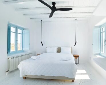 Double bedroom with ceiling fan at Villa Uranos in Psarou, Mykonos
