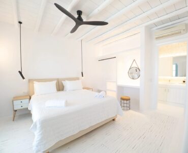 Bedroom with ceiling fan at Villa Uranos in Psarou, Mykonos